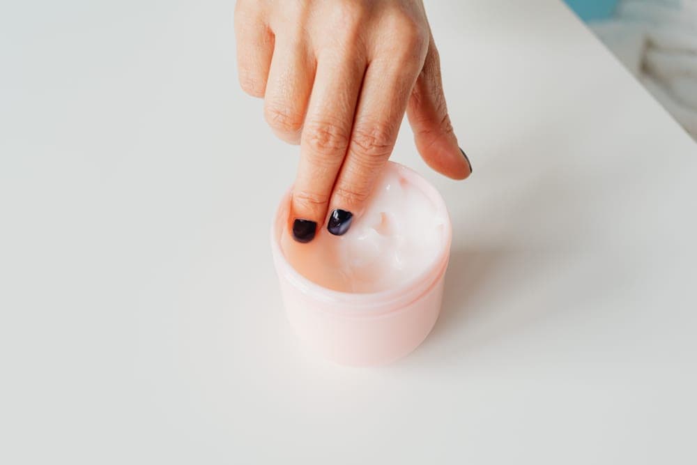 A serum dropper bottle on a neutral surface