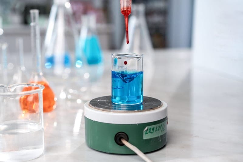 A dropper releasing liquid, illustrating ingredient science